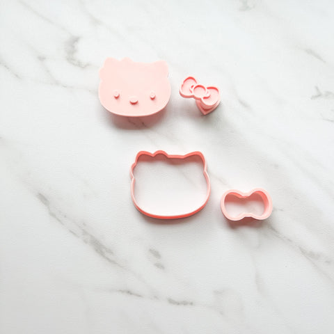 HELLO KITTY FACE AND BOW EMBOSSER/CUTTER SET BY CREATIVE HEART LAB
