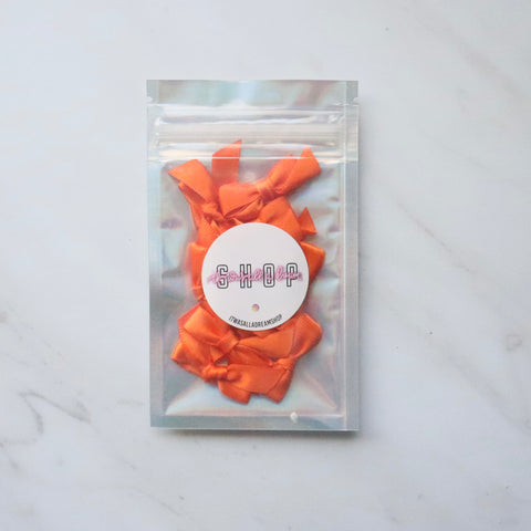 PRE TIED TINY SATIN BOWS (ORANGE)